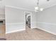 View of the dining room leading into the kitchen with stainless appliances at 105 Rosewood Cir, Covington, GA 30016