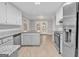 Modern kitchen with granite countertops, stainless steel appliances, and white cabinets at 105 Rosewood Cir, Covington, GA 30016