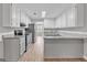 Updated kitchen featuring granite countertops, stainless steel appliances, and white cabinets at 105 Rosewood Cir, Covington, GA 30016