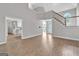 Bright living room featuring neutral colors, hardwood floors, and staircase at 105 Rosewood Cir, Covington, GA 30016