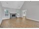 Spacious living room with hardwood floors, fireplace, and lots of natural light at 105 Rosewood Cir, Covington, GA 30016