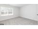Well-lit bedroom featuring a window with blinds and neutral carpet at 626 Cantrell Drive, Dallas, GA 30157