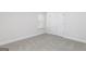 This carpeted bedroom features a window with blinds and a closet at 100 Cantrell Drive, Dallas, GA 30157