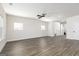 Bright living room boasts sleek hardwood flooring, a modern ceiling fan, and plenty of natural light at 100 Cantrell Drive, Dallas, GA 30157