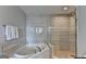 Stylish bathroom featuring a soaking tub, modern shower, and elegant finishes at 285 Centennial Olympic Park Drive Northwest Nw Dr # 1905, Atlanta, GA 30339