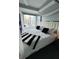 Stylish bedroom featuring a unique four-poster bed and neutral decor at 285 Centennial Olympic Park Drive Northwest Nw Dr # 1905, Atlanta, GA 30339