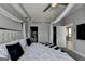 Bedroom featuring a large bed, neutral tones, and access to en-suite bathroom at 285 Centennial Olympic Park Drive Northwest Nw Dr # 1905, Atlanta, GA 30339