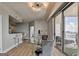 Elegant dining room with bar, balcony access, and city views through expansive windows at 285 Centennial Olympic Park Drive Northwest Nw Dr # 1905, Atlanta, GA 30339