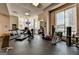 Well-lit gym with modern equipment, including treadmills and weight machines, for resident fitness at 285 Centennial Olympic Park Drive Northwest Nw Dr # 1905, Atlanta, GA 30339