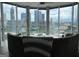 Bright living room with floor-to-ceiling windows showcasing a stunning city skyline view at 285 Centennial Olympic Park Drive Northwest Nw Dr # 1905, Atlanta, GA 30339