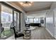 Bright and airy living space featuring hardwood floors, a balcony with seating, and skyline views at 285 Centennial Olympic Park Drive Northwest Nw Dr # 1905, Atlanta, GA 30339