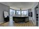 This modern living room boasts floor-to-ceiling windows with panoramic city views at 285 Centennial Olympic Park Drive Northwest Nw Dr # 1905, Atlanta, GA 30339