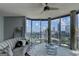 This modern living room boasts floor-to-ceiling windows with panoramic city views at 285 Centennial Olympic Park Drive Northwest Nw Dr # 1905, Atlanta, GA 30339