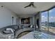 This modern living room boasts floor-to-ceiling windows with panoramic city views at 285 Centennial Olympic Park Drive Northwest Nw Dr # 1905, Atlanta, GA 30339
