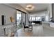 Stylish living and dining area with hardwood floors, balcony access, and modern decor at 285 Centennial Olympic Park Drive Northwest Nw Dr # 1905, Atlanta, GA 30339
