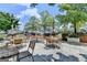 Charming outdoor patio with tables, chairs, and barbecue grills for resident gatherings and dining at 285 Centennial Olympic Park Drive Northwest Nw Dr # 1905, Atlanta, GA 30339