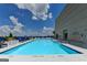 Rooftop pool with lounge chairs and sunny sky at 285 Centennial Olympic Park Drive Northwest Nw Dr # 1905, Atlanta, GA 30339