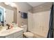 Well-lit bathroom with a shower-tub combo and white vanity sink offering ample counter space at 2069 Countydown Ln, Stone Mountain, GA 30088