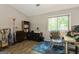 Inviting bedroom featuring a desk, bookcase and bright window offering ample natural light at 2069 Countydown Ln, Stone Mountain, GA 30088