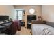 Bedroom featuring comfortable daybed, desk, and neutral carpet, ideal for relaxation or work at 2069 Countydown Ln, Stone Mountain, GA 30088