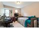Bedroom featuring comfortable daybed, desk, and neutral carpet, ideal for relaxation or work at 2069 Countydown Ln, Stone Mountain, GA 30088