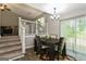 Dining room features a modern chandelier, neutral walls, and sliding doors, providing an inviting space for meals at 2069 Countydown Ln, Stone Mountain, GA 30088