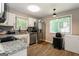 Well-lit kitchen featuring stainless steel appliances, granite countertops, and white cabinets, offering a clean and modern space at 2069 Countydown Ln, Stone Mountain, GA 30088