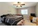 Cozy main bedroom with ceiling fan, soft carpet, and a warm, inviting atmosphere at 2069 Countydown Ln, Stone Mountain, GA 30088
