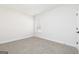 Empty bedroom with carpet floors, a bright window, and neutral paint at 608 Cantrell Drive, Dallas, GA 30157