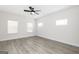 Bright bedroom with wood-look floors, three windows, and neutral walls, offering a peaceful retreat at 608 Cantrell Drive, Dallas, GA 30157