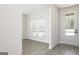 Bright, open living room with wood-look floors, a large window, and neutral paint, creating a welcoming space at 608 Cantrell Drive, Dallas, GA 30157