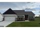 Beautiful single-Gathering home featuring a two-car garage and manicured front lawn at 52 Cantrell Drive, Dallas, GA 30157