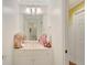 Fresh and bright bathroom with a single vanity, modern fixtures, and crisp, white finishes at 606 Wingspread, Peachtree City, GA 30269