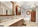 Stylish bathroom with double vanity, soaking tub, and elegant fixtures, creating a spa-like atmosphere at 606 Wingspread, Peachtree City, GA 30269
