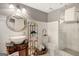 Elegant bathroom features modern sink, decorative shelving, and tiled shower at 606 Wingspread, Peachtree City, GA 30269