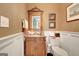 Charming powder room with wainscoting and ornate vanity at 606 Wingspread, Peachtree City, GA 30269