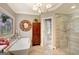 Bright bathroom with soaking tub, glass enclosed shower, and sophisticated fixtures, exuding spa-like tranquility at 606 Wingspread, Peachtree City, GA 30269
