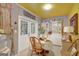 Unique dining area featuring a dining table set for two and a retro decor theme with storage all around at 606 Wingspread, Peachtree City, GA 30269