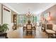 Formal dining room featuring a large window, elegant chandelier, and classic furnishings at 606 Wingspread, Peachtree City, GA 30269
