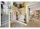 Grand foyer with a curved staircase and detailed wrought iron railing at 606 Wingspread, Peachtree City, GA 30269