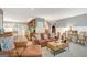 Comfortable living room with a leather sofa opens up to the kitchen, with views into other rooms at 606 Wingspread, Peachtree City, GA 30269