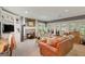 Cozy living room features a stone fireplace, built-in shelves, and ample natural light from the many windows at 606 Wingspread, Peachtree City, GA 30269