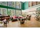 Spacious living room featuring large windows, hardwood floors and stylish decor at 606 Wingspread, Peachtree City, GA 30269