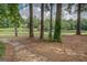 Beautiful backyard view with a pond and lush greenery at 9187 Golfside Cir, Covington, GA 30014