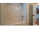 Shower/tub combo with tile flooring at 9187 Golfside Cir, Covington, GA 30014