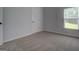 Bedroom with neutral carpet and a window with natural light at 9187 Golfside Cir, Covington, GA 30014