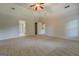 Spacious bedroom with plush carpet and multiple doorways, offering privacy and convenience at 9187 Golfside Cir, Covington, GA 30014