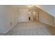 Large bonus room featuring three doors and neutral carpet at 9187 Golfside Cir, Covington, GA 30014