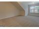 Spacious carpeted bonus room with natural light from a window at 9187 Golfside Cir, Covington, GA 30014