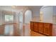 Open dining space with hardwood floors, chandelier, and easy access to the kitchen at 9187 Golfside Cir, Covington, GA 30014